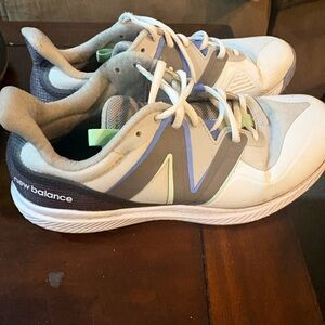 New Balance woman’s White, Gray, and Blue Sneakers